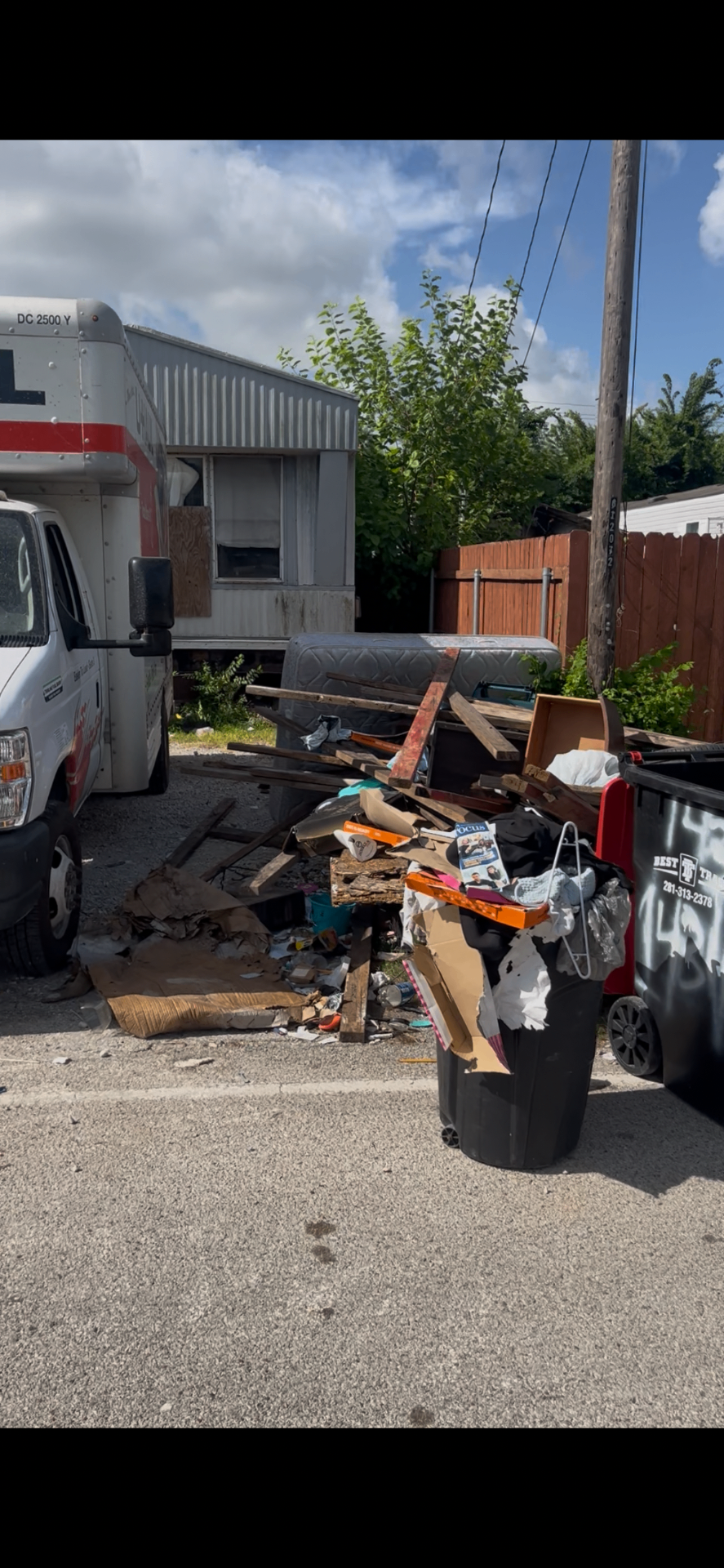Houston alley and driveway cleanout by Holman Hauling — before