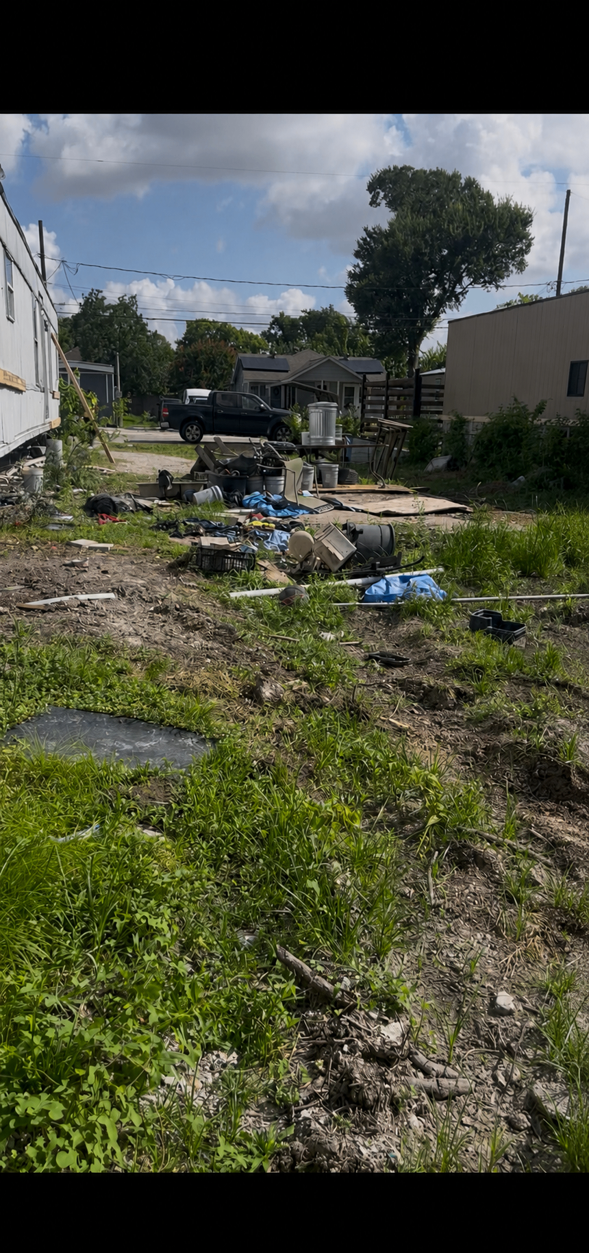 Houston backyard and side-lot cleanup by Holman Hauling — before